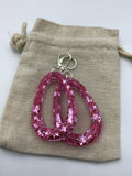 Pink Glittery sparkling dangly resin oval hoop earrings in silver, modern, statement, funky jewelry