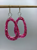 Pink Glittery sparkling dangly resin oval hoop earrings in silver, modern, statement, funky jewelry