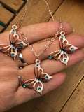 Rose gold butterfly necklace enameled in blue or purple