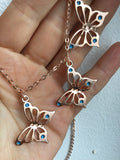 Rose gold butterfly necklace enameled in blue or purple