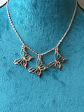 Rose gold butterfly necklace enameled in blue or purple
