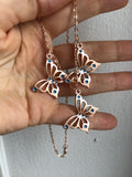 Rose gold butterfly necklace enameled in blue or purple