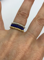 Trio beaded stack rings in greenery, cobalt blue, cherry red and one gold and one silver
