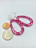 Pink Glittery sparkling dangly resin oval hoop earrings in silver, modern, statement, funky jewelry