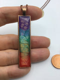 Tie dye style enameled long pendant necklace in rainbow colors perfect one of a kind keepsake perfect for gift for him or her