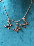 Rose gold butterfly necklace enameled in blue or purple