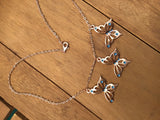 Rose gold butterfly necklace enameled in blue or purple